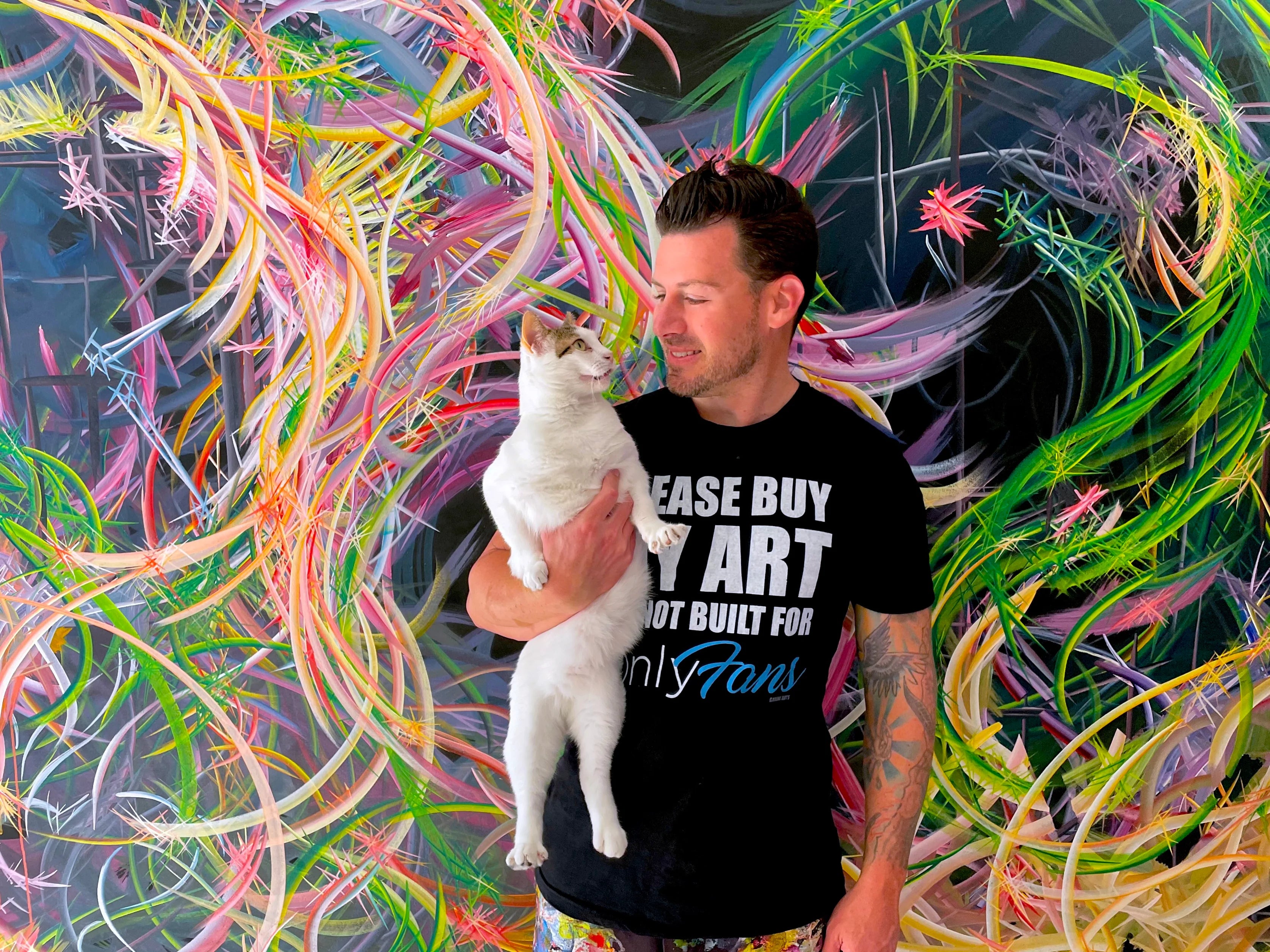 Michael Carini and his cat Braska in their studio at Carini Arts. Braska has been "Employee of the Month" for 60+ months since she walked into his life.