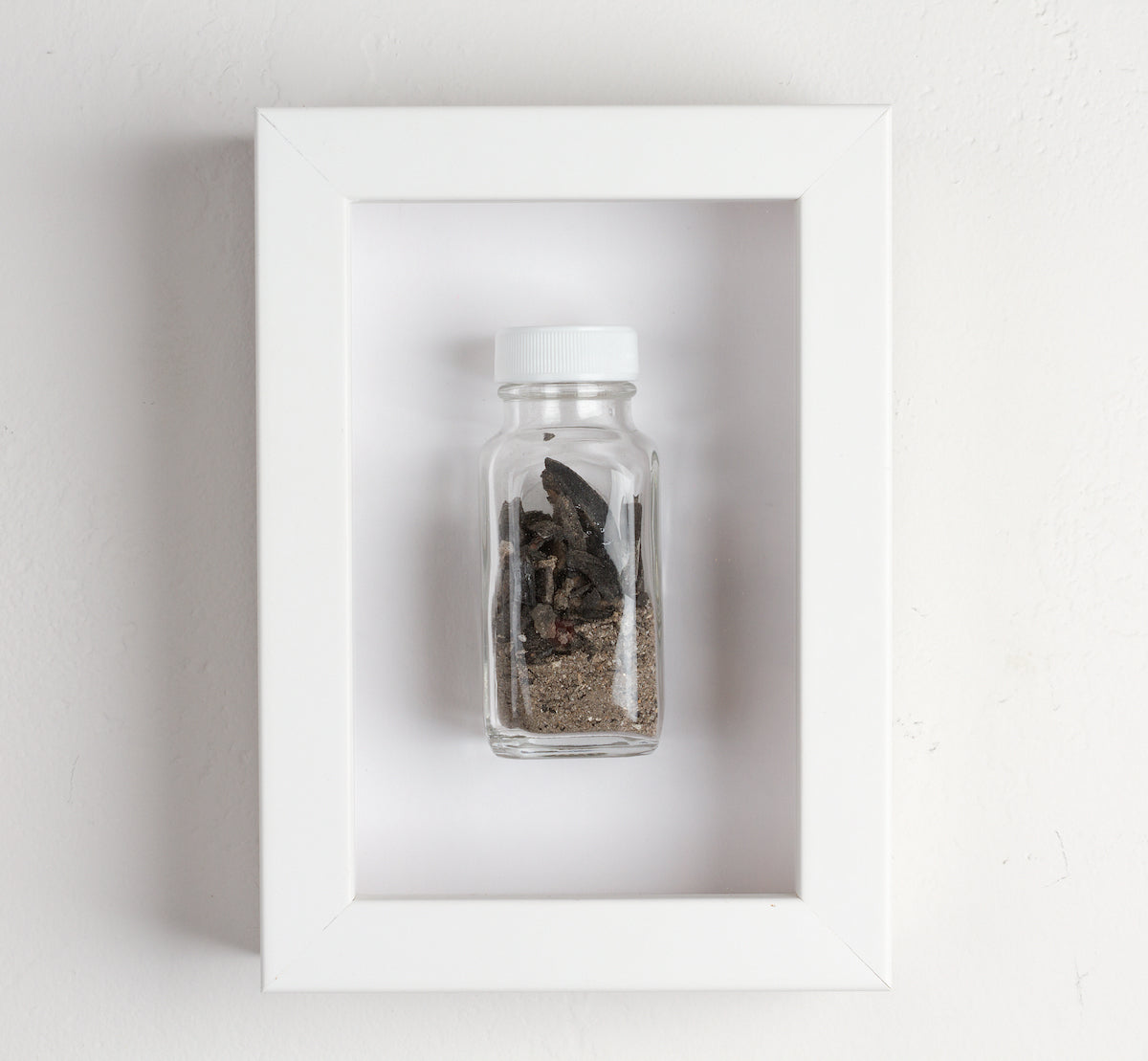 artist collects ashes from painting sacrificed by fire