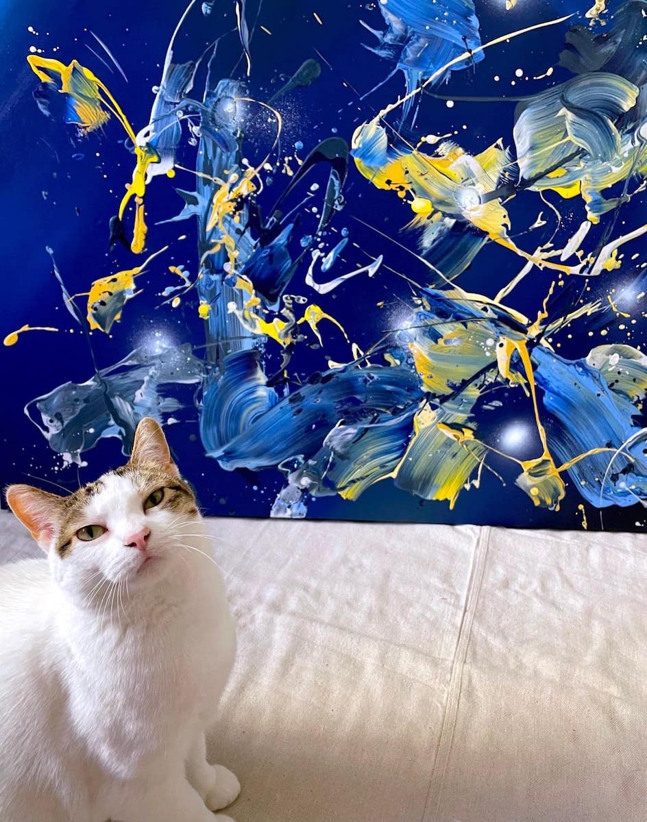 Braska Carini proudly showing off our new painting and letting you know that she's the "Employee of the Month" at Carini Arts.