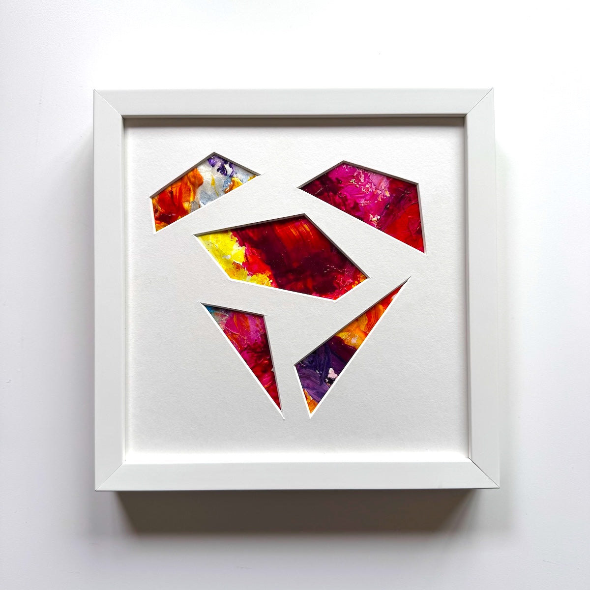 Michael Carini puzzled hearts are created from recycled paint palettes. Palette art you can touch.