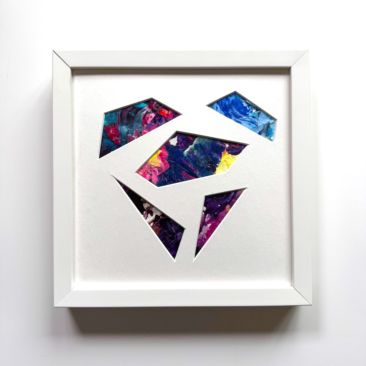 Michael Carini puzzled hearts are created from recycled paint palettes. Palette art you can touch.