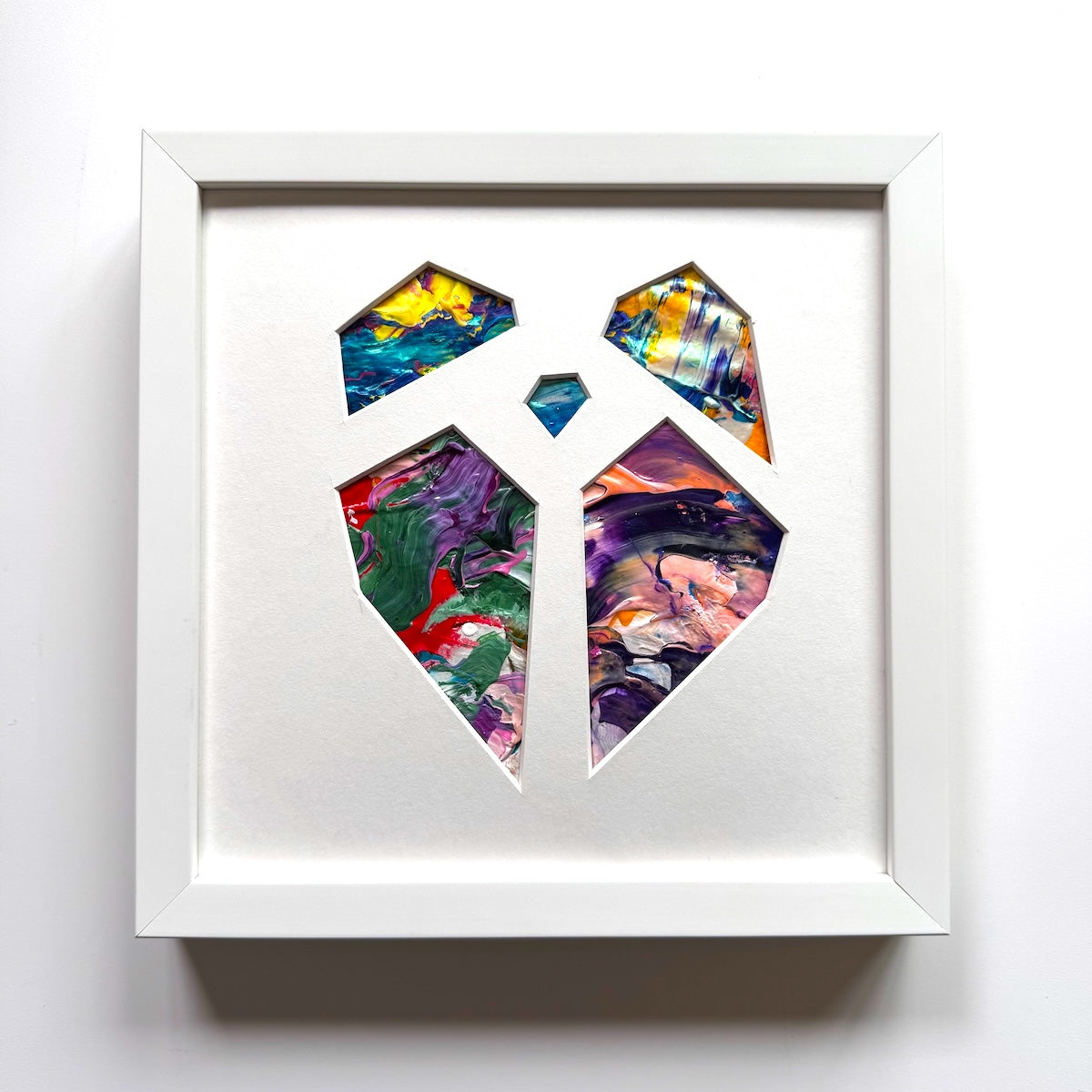 Michael Carini puzzled hearts are created from recycled paint palettes. Palette art you can touch.